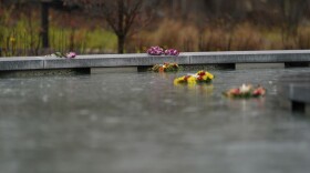 Flowers adorn a memorial to the victims of the Sandy Hook Elementary School shooting, in Newtown, Conn., Sunday, Nov. 13, 2022. (AP Photo/Bryan Woolston)