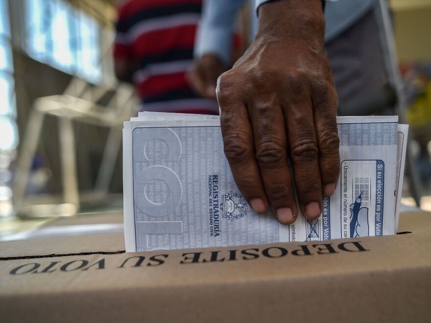 A man casts his vote at a polling station in Cali, Valle del Cauca Department, during parliamentary elections in Colombia on March 11. The elections are the first that FARC will partake in as a legal political party. (Luis Robayo/AFP/Getty Images)