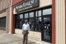 Michael Benton, owner of Stark and Legum, stands outside his storefront on Granby Street in Norfolk. Benton says a new city grant program is only a temporary fix for NEON District businesses.