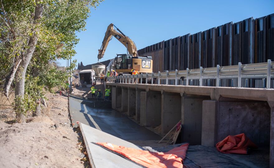 Contractors are building concrete culverts across creekbeds on the border. Property owners warn the steel bollard wall across the creeks will catch debris and worsen flooding.