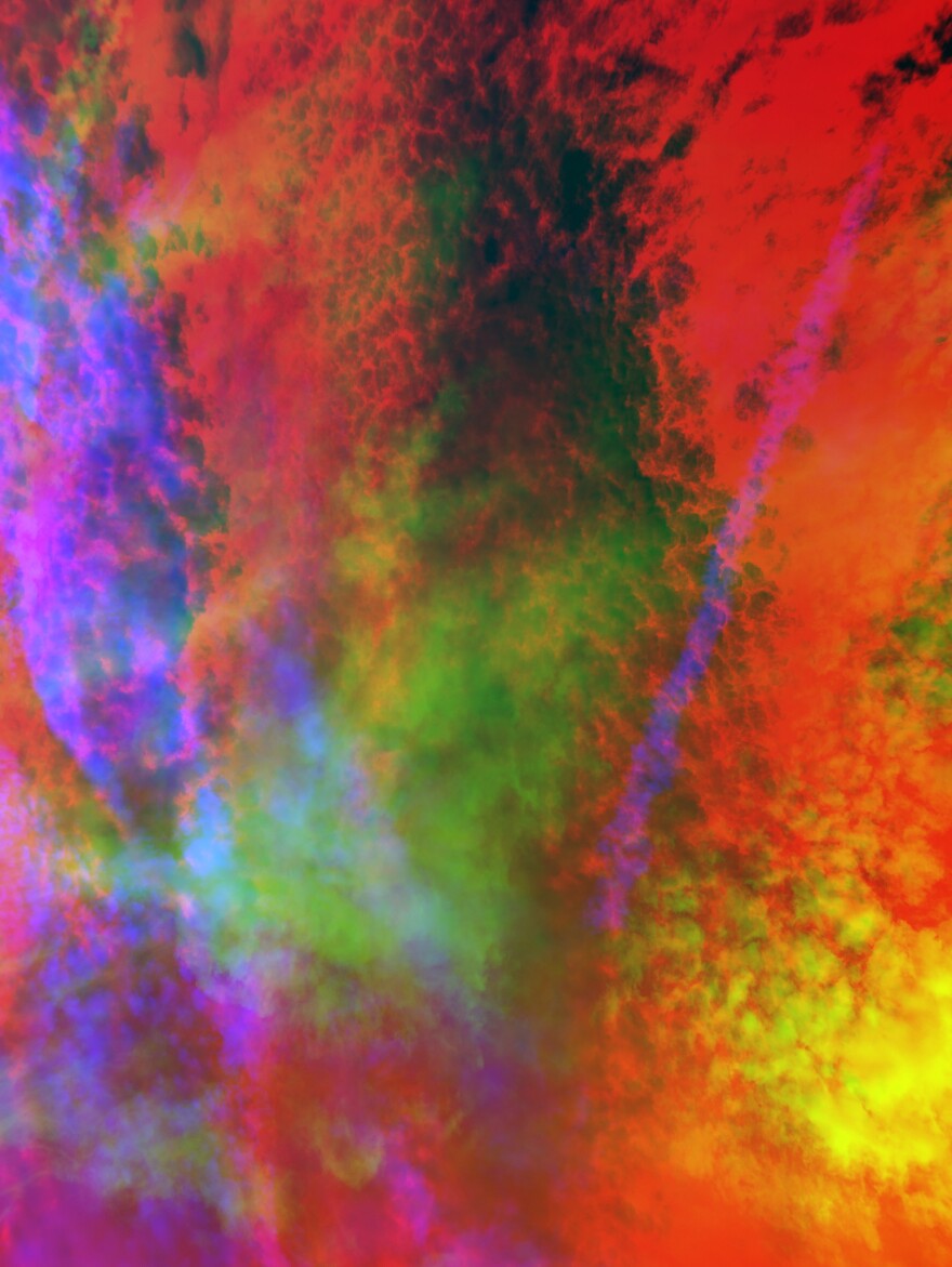 Abstract red, light green, and yellow clouds are overlaid upon a dark background.