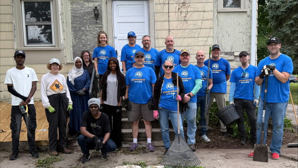 Volunteers as part of United Way Day of Caring, responsible for sprucing up the two yards.