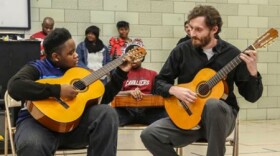 Damian Goggans (left) performs with Cleveland Classical Guitar Society director of education Brian Gaudino