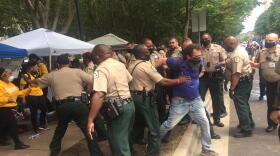 Mecklenburg sheriff's deputies remove people from the jail support station Thursday.