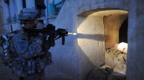 A Soldier from the 508th Parachute Infantry Regiment clears a building in Afghanistan in this 2010 file photo. A unit from the Regiment will reunite in 2019 for mental health treatment.