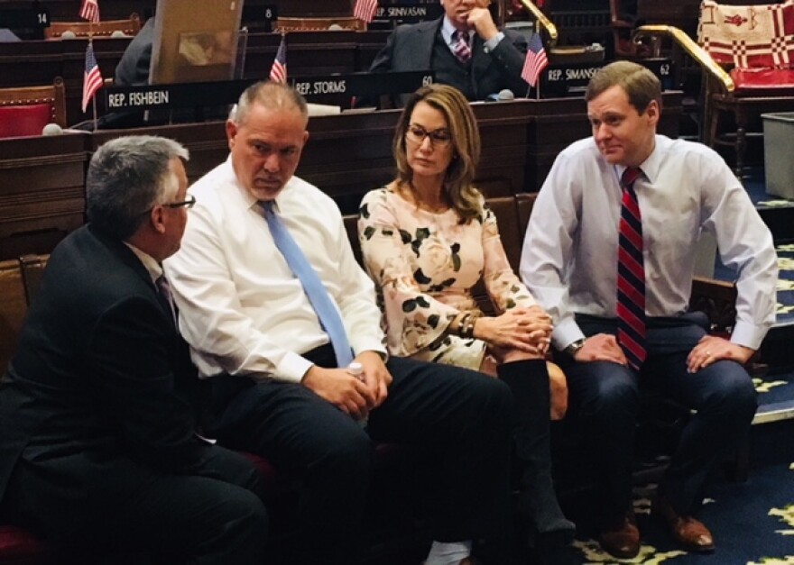 A bipartisan budget huddle in 2018. From left, Rep. Vincent Candelora, House Speaker Aresimowicz, Minority Leader Themis Klarides and Majority Leader Matt Ritter.
