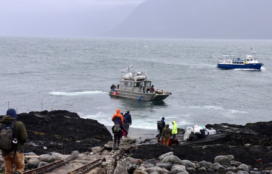 Volunteers prepare to board a small boat, which will transfer them to a larger boat to make the journey from Eldred Rock to Haines on May 17, 2026.