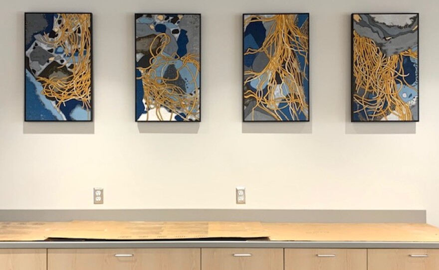 Sara Tabbert's artwork behind the new library's desk.