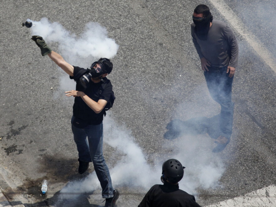 Earlier today (June 28, 2011) in Athens, a demonstrator threw a tear gas grenade back toward police.