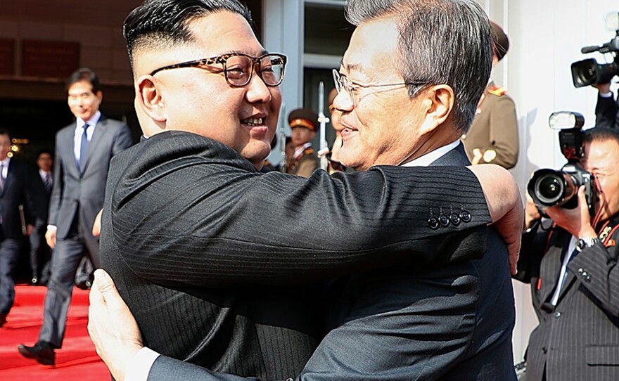 North Korean leader Kim Jong Un (left) and South Korean President Moon Jae-in embrace Saturday on the North Korean side of the shared inter-Korean area of Panmunjom.