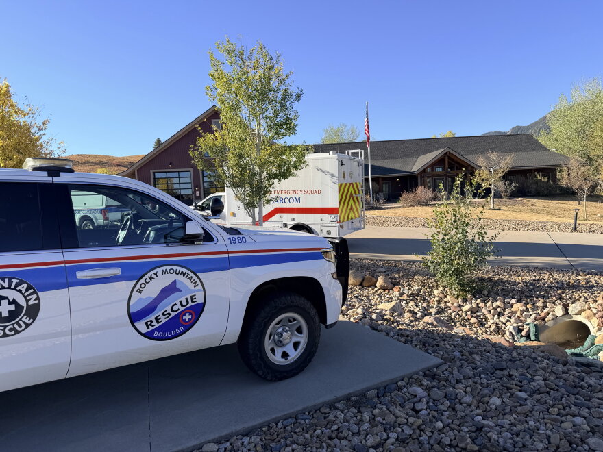 First responder vehicles parked outside a building