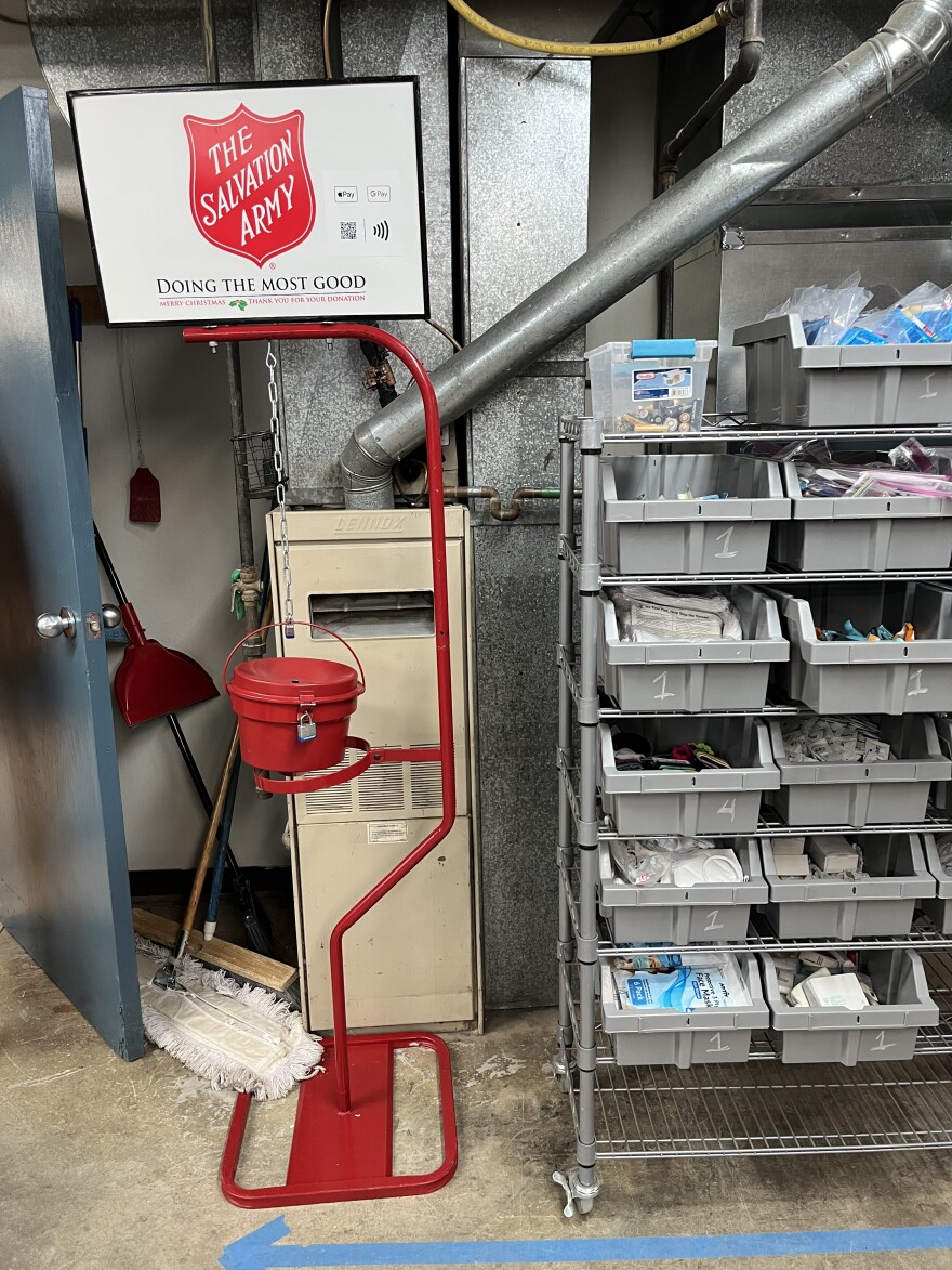 A famous red kettle donation container stands in the storage room of the Gillette Service Center. Donations have declined in the COVID era but have steadily risen since 2020. Around $60,000 was raised in 2022, which is down from around $70,000 before the pandemic. The kettle donations make up about one third of the Service Center's yearly budget.