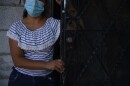 A Honduran woman receives a food donation from Seguimos Adelante in Ciudad Juárez on September 24, 2020.