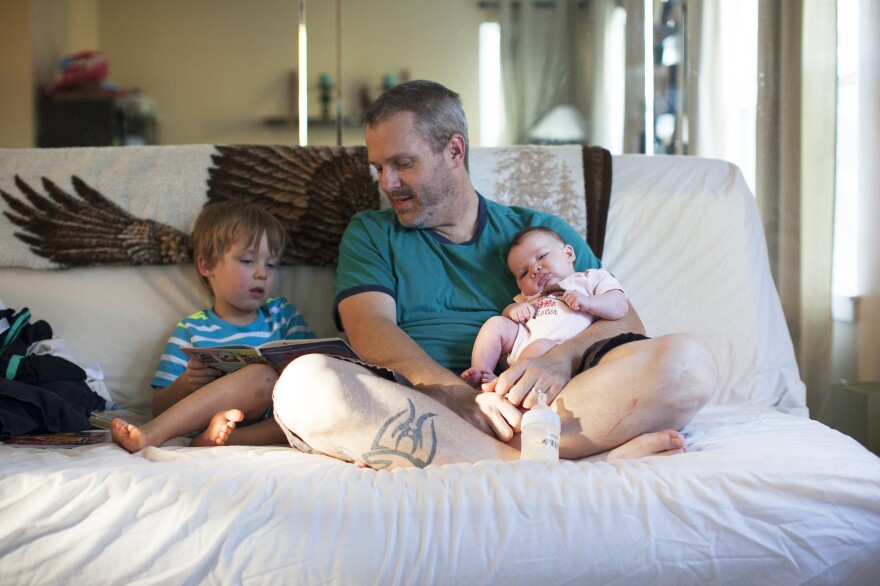 Benjamin reads to Mike and Olivia. When Benjamin was born Cruse was working at a different company and says he wasn't able to take any vacation time. He could only take five unpaid days.