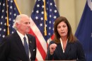South Carolina Gov. Henry McMaster, left, listens as Lt. Gov. Pamela Evette, right, speaks at a news conference on Monday, Jan. 12, 2026, in Columbia, S.C. (AP Photo/Jeffrey Collins)
