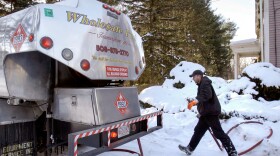 FILE: Jason Kilpatrick of Wholesale Fuel heads back to his truck after making a delivery of home heating oil in Framingham, Mass. Of Connecticut’s $80 million annual LIHEAP allocation, 10% is administered retroactively, once the winter season ends.