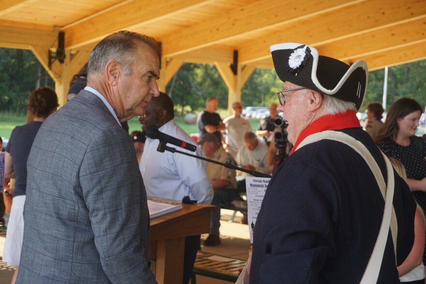 Gov. Mike Kehoe speaks with a Revolutionary War reenactor during an event in Rolla on Monday night. Afterward, he made comments about the defeat of Amendments 4  and 5 as well as his trip to Panama.