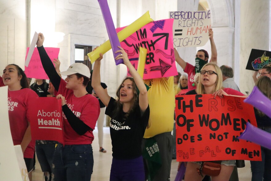Protestors rally outside the Senate chamber at the West Virginia state Capitol in Charleston, W.Va., as lawmakers debated a sweeping bill to ban abortion in the state with few exceptions on Tuesday, Sept. 13, 2022. Several Republican lawmakers have said they hope the bill will make it impossible for the state's only abortion clinic to continue to offer the procedure.
