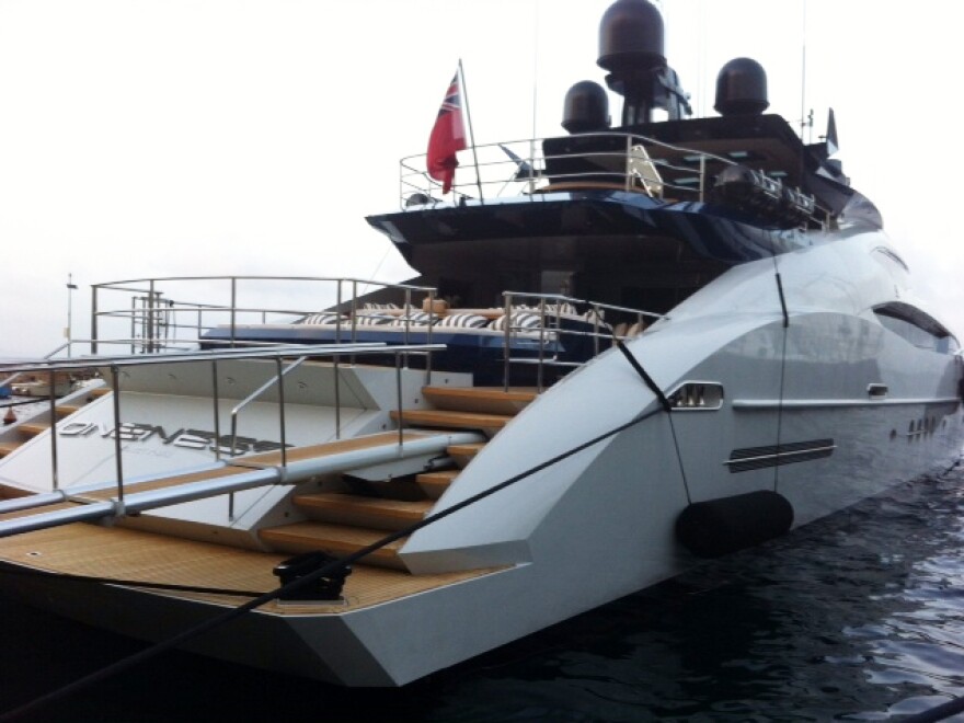 A foreign yacht is berthed at Porto Santo Stefano. Italian police have been raiding ports to check if yacht owners have been paying enough taxes.