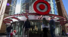 Pedestrians pass a Target store near the Target Corporation's headquarters Thursday, Jan. 30, 2025, in Minneapolis, Minn. (AP Photo/Ellen Schmidt)