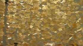 "Rain" by Ann Arbor artist Lynda Cole 'is a kinetic sculpture using 7600 squares of silver leaf on polyester film. The squares are suspended within a 10 ft. cube of space and move with ambient air current.'