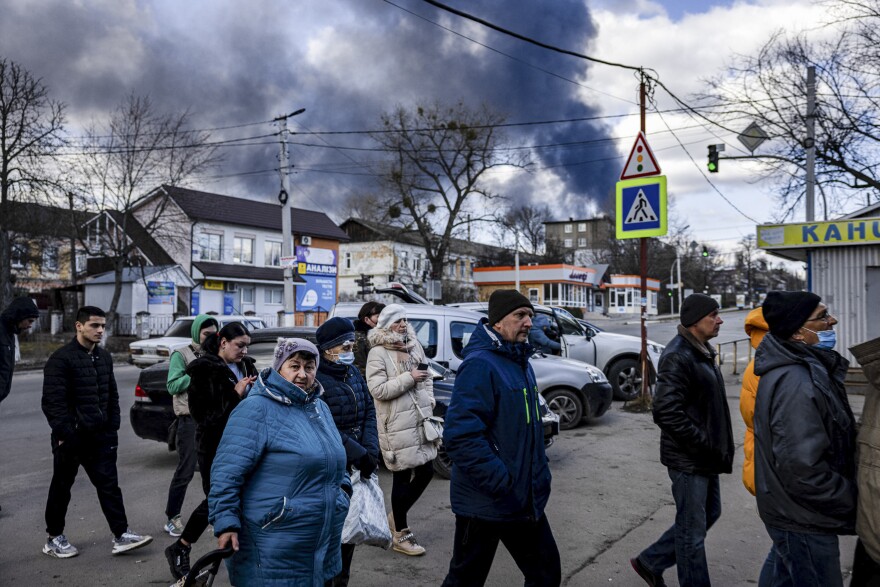 People line up in front of a supermarket in the Ukrainian town of Vasylkiv, just outside Kyiv on Feb. 27. Overnight, Russian strikes hit a nearby oil depot.