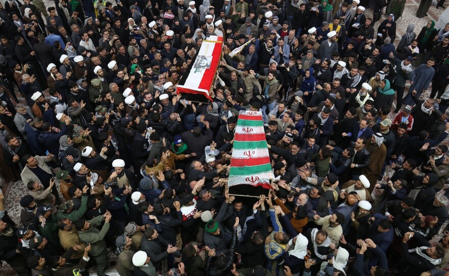 Mourners carry the coffins of Gen. Qassem Soleimani and Abu Mahdi al-Muhandis in Najaf, Iraq.