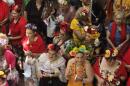 An array of Friday look-alikes line up by the stage before a promenade across the stage for happy fans and family.