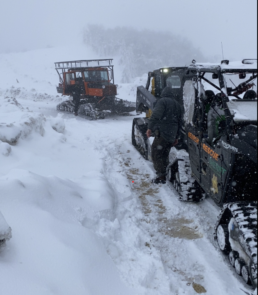 Mendocino County Search and Rescue vehicles in the snow.