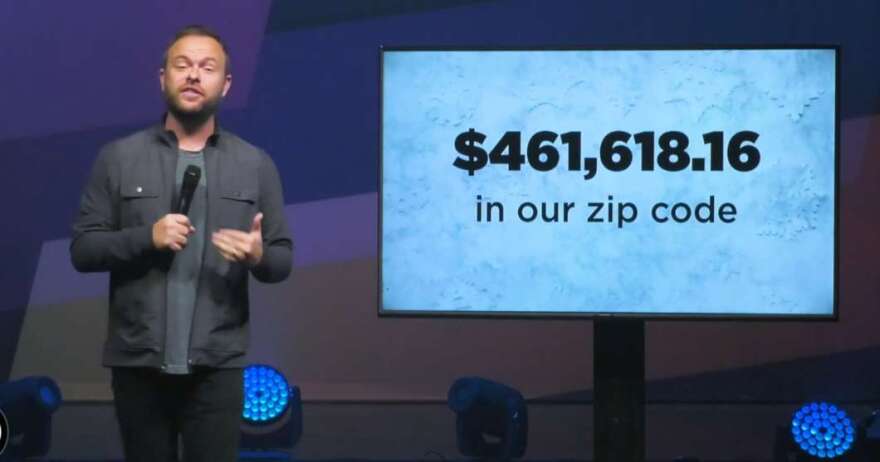 Jason Burns talks to the congregation about paying off medical debt for 1,315 Lakeland residents. Image: Access Church Facebook page