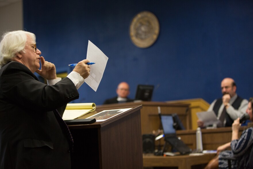 Defense attorney William DePaulo cross examines expert witness Marshall Robinson about the surveyed map presented as evidence in the case.