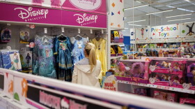 A woman browses the costume selection in Toys "R" Us in 2017. (Leon Neal/Getty Images)