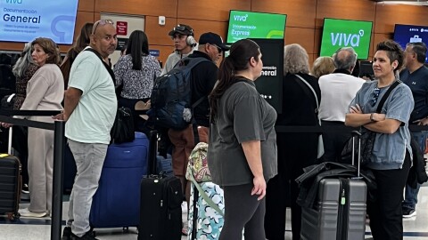 Passengers in line at a ticket counter at SAT