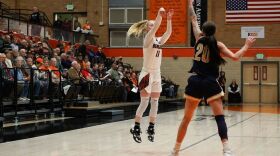Basketball action in Reed Gym