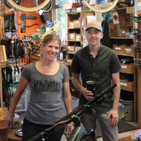 Sue and Eugene Cathcart, co-owners and partners at Oakridge's Willamette Mountain Mercantile stand near the front of their store in this July 13, 2026 photo.