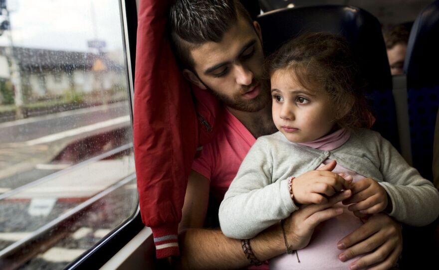 <strong><a href="http://apps.npr.org/syria/">READ: With Syria engulfed in civil war, here are four stories of families trying to stay together</a></strong><br />More than 200,000 refugees have settled in Europe since the start of the Syrian conflict.