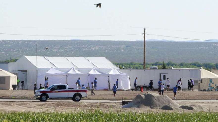 The Pentagon plans to build temporary camps for detained immigrants. Here, children of detained migrants are seen at a tent encampment near the U.S. Customs and Border Protection port of entry in Tornillo, Texas