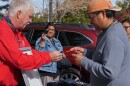 Ed Franklin shows one participant how to take a reading on a solar panel, during the Native Waters on Arid Lands 2019 Tribal Summit in Reno, Nev.