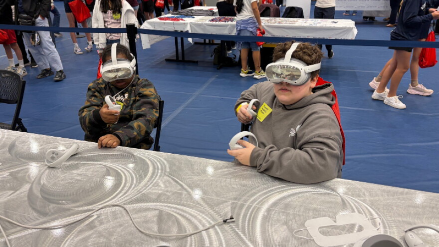 Students use virtual reality headsets at Tech Week Grand Rapids' Tech Showcase.