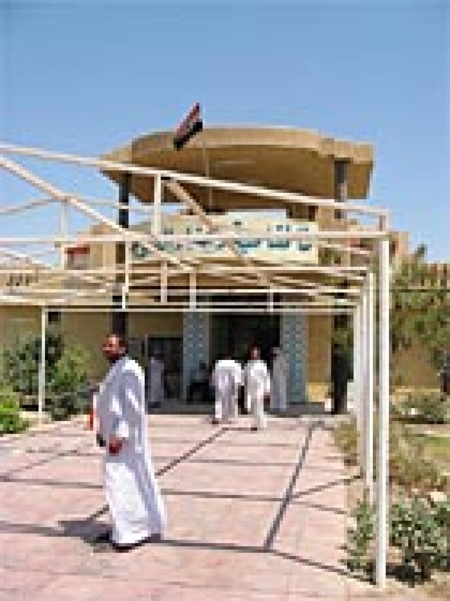 Constituents come and go outside the mayor's office in Fallujah.