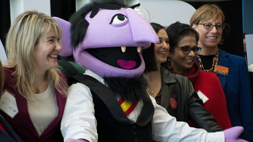 Sesame Street's the Count poses with attendees at a U.S. Census Bureau event in Cleveland. [Nick Castele / ideastream]