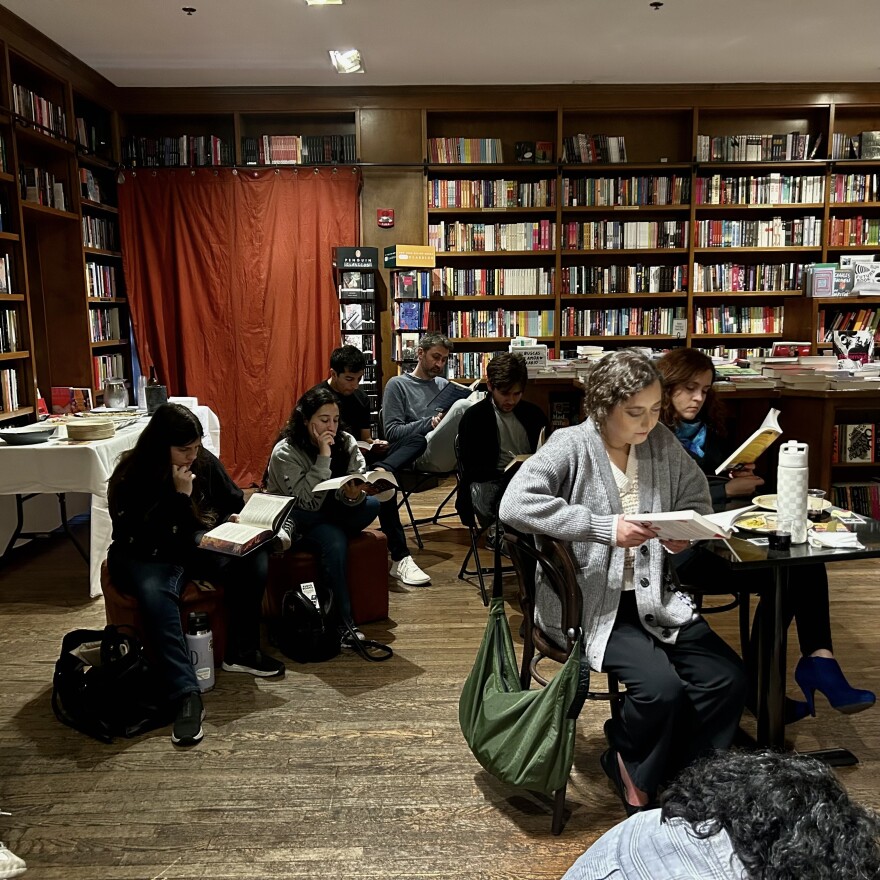 Participants like Ana Karla Tamayo (right), read silently at Books & Books in Coral Gables.