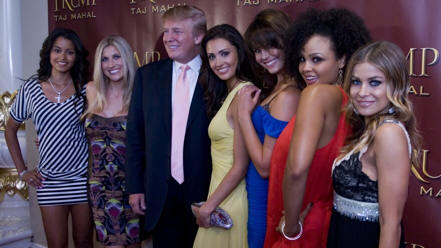 Donald Trump poses with the "Deal or No Deal Girls" and actress Carmen Electra (far right) at his 61st Birthday Bash at the Taj Mahal in Atlantic City, N.J. in June 2007.