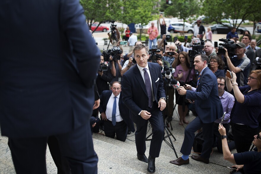 Gov. Eric Greitens walks away from reporters after making a statement Monday outside the Circuit Court building in downtown St. Louis.