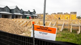 Over a hundred of houses are under construction in Austin's Mueller development. The city says it expects to partially automate the evaluation of building applications next year.
