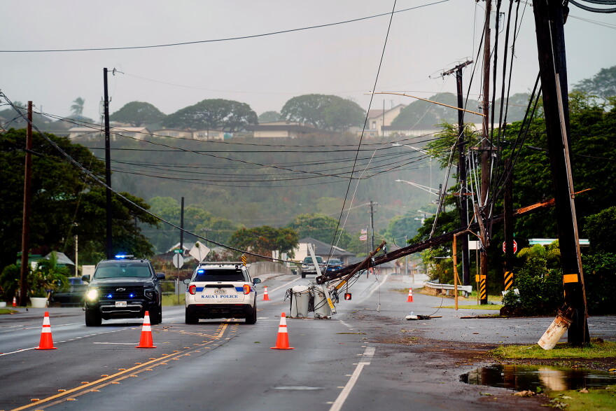 Downed power lines caused by Hurricane Lowell are seen across a road Tuesday, Sept. 8, 2026, in Hanapēpē, Kauaʻi, Hawaiʻi.