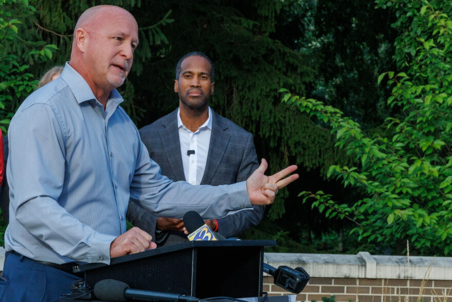 U.S. Rep. John James, the Republican nominee for Michigan governor, looks on as his running mate, state Rep. Jay DeBoyer, speaks at a Charlie Kirk memorial press conference at Michigan State University in East Lansing, Mich., on Sept. 10, 2026.