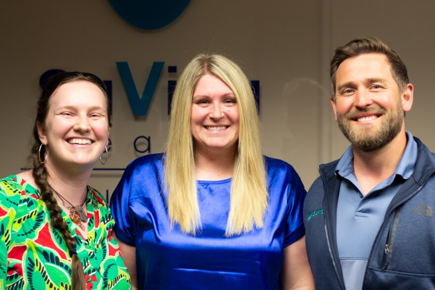 From left, Anna Wykes, Tabytha Brown, and Kyle Jones work in the Harrisonburg office.