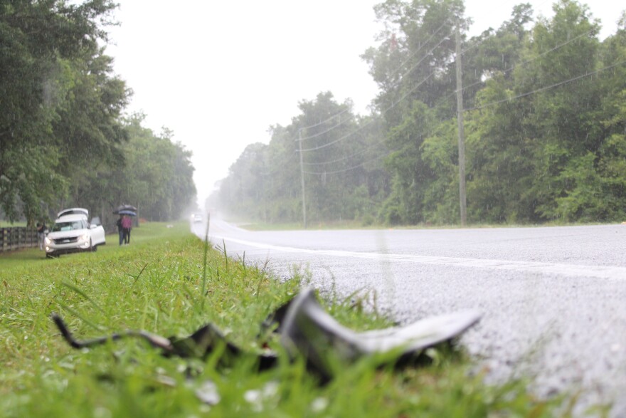 Debris on State Road 40 west of Ocala following a fatal bus crash, killing eight people on May 14. (Ella Thompson/WUFT News)