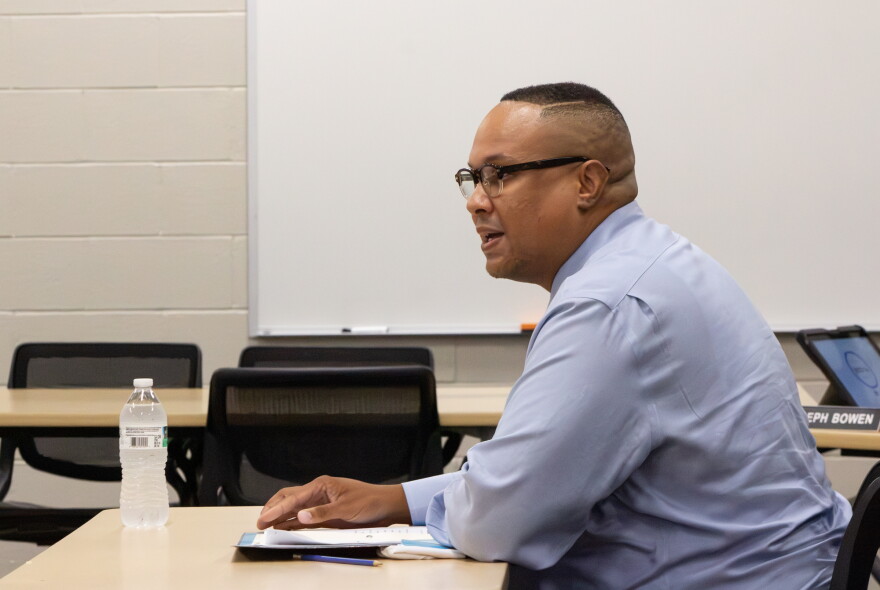 Brock Booker talks with members of the Wichita Board of Education on Friday as he interviews for a vacancy.